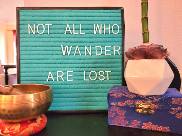 Therapist's message of hope in their office reading, "All who wander are not lost."